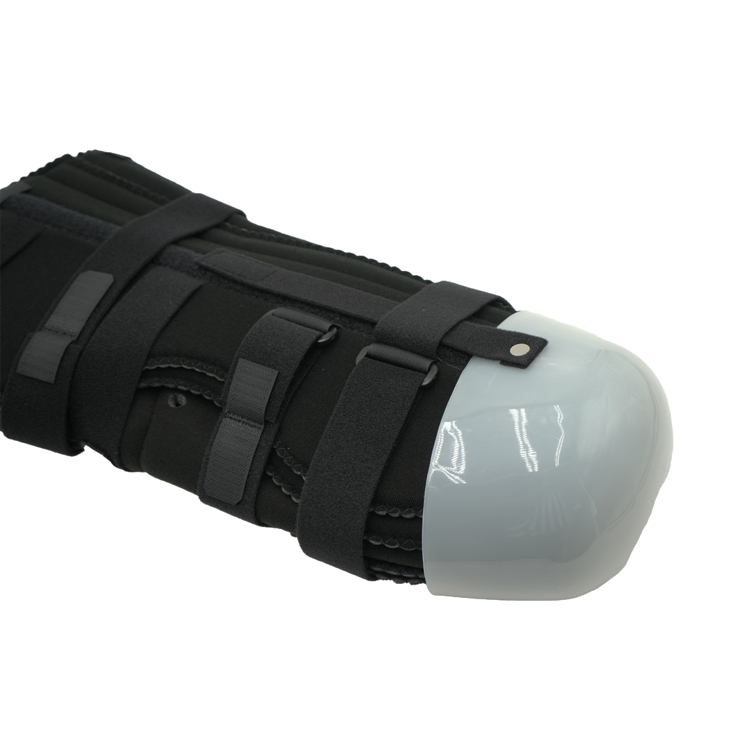 Below knee amputee rigid dressing protector with tri-panel design, black adjustable straps, and smooth white end cap, made.