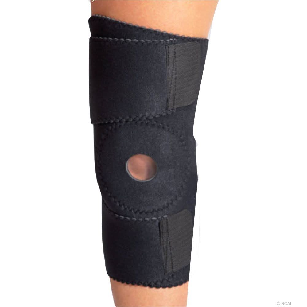 Black wrap-around knee brace with open patella buttress, made of neoprene material, secured by two wide Velcro straps,.