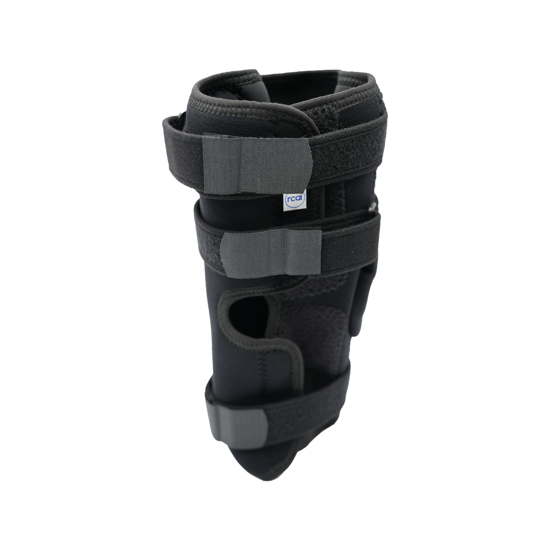 Black RCAI Deluxe Wrap Knee brace with adjustable Velcro straps and breathable mesh panels, made in the USA, ideal for B2B.