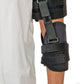 Black neoprene shoulder stabilizer with adjustable straps and buckles on a person's arm, made in the USA, best orthopedic.