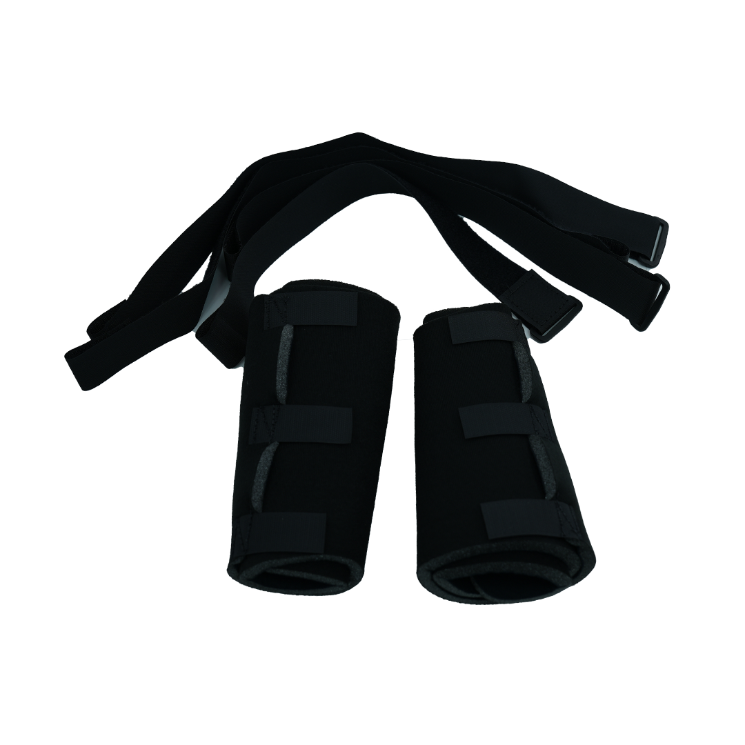 Black pediatric knee brace accessory kit with two padded cylindrical supports and adjustable securing straps.