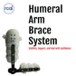 Humeral arm brace system in beige with multiple adjustable straps on black frame, labeled RCAI, made in the USA, designed.